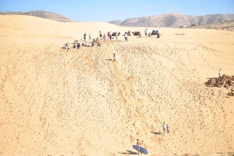 Group of sandboarder in small Sahara Morocco