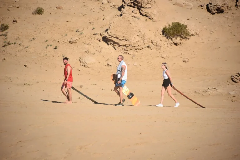 Sandboarders on the trail in small Sahara Morocco