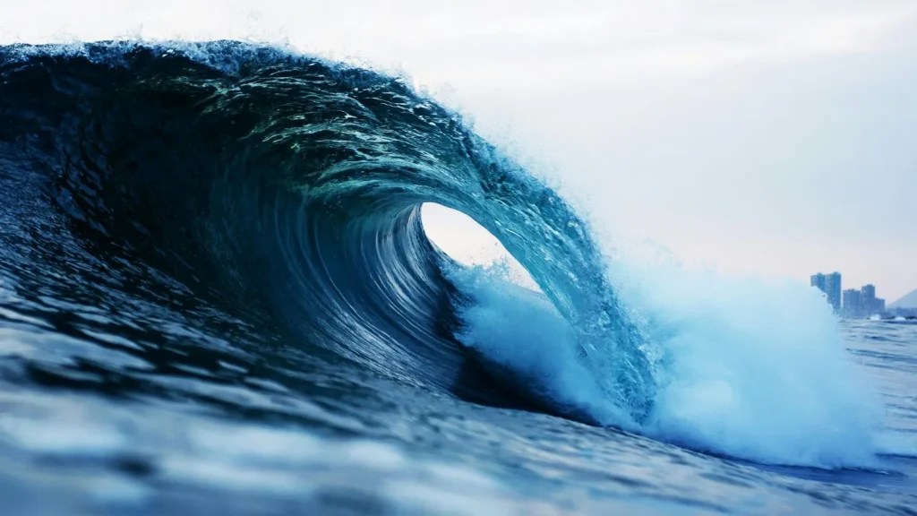 big wave breaks as tube