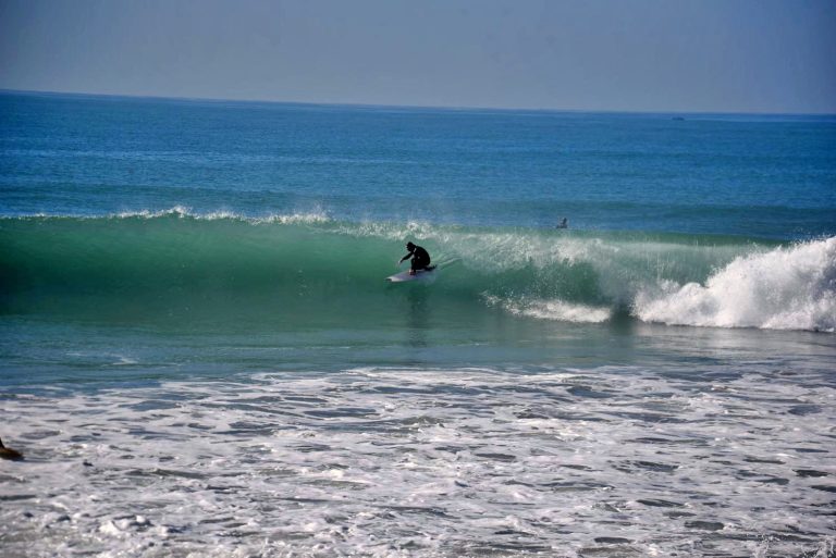 Surfers in a small tube at Anchor Point