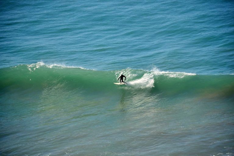 Lonely surfer enjoys the ride at Killer Point