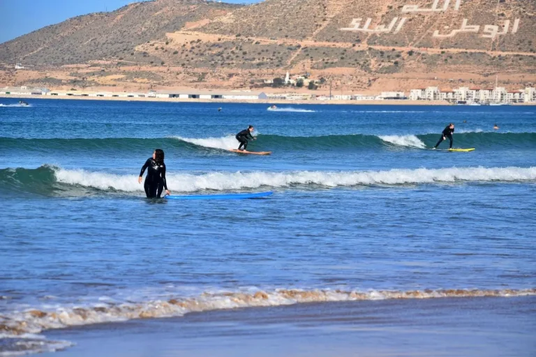 Female surfers ride their first green waves on Agadir beach