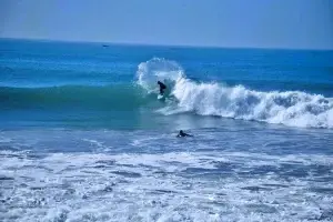 An experienced surfer rides a green wave at Anchor Point in Taghazout Morocco