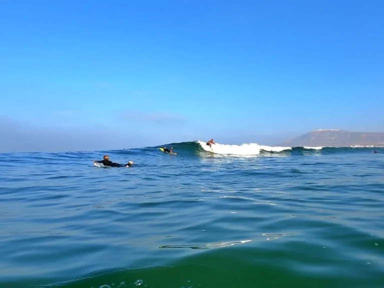 Surfers at Palm Beach surf spot in Agadir