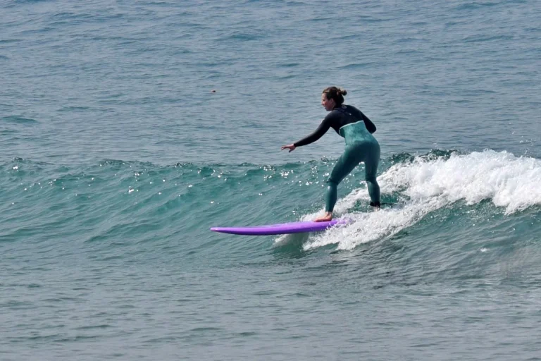 Beginner surfer riding a long wave in Imsouane