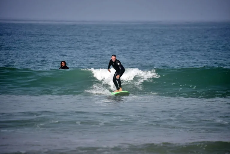 Surfing beginner rides green waves for the first time